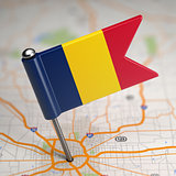 Chad Small Flag on a Map Background.