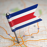 Costa Rica Small Flag on a Map Background.