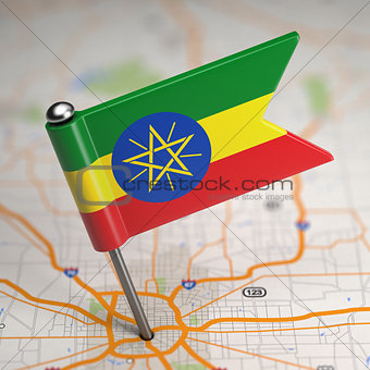 Ethiopia Small Flag on a Map Background.