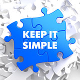 Keep It Simple Concept on Blue Puzzle.