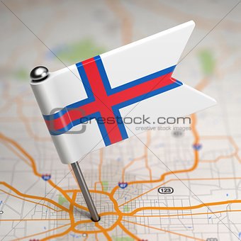 Faroe Islands Small Flag on a Map Background.