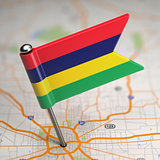 Mauritius Small Flag on a Map Background.