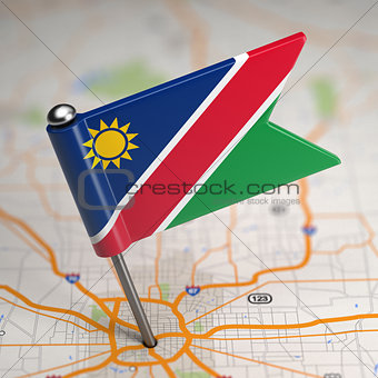 Namibia Small Flag on a Map Background.