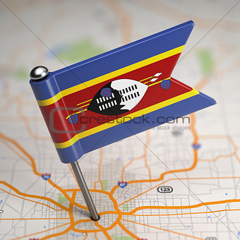 Swaziland Small Flag on a Map Background.