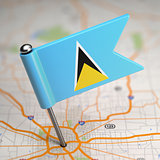 Saint Lucia Small Flag on a Map Background.