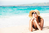 long haired girl in bikini on tropical beach