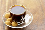 cup of black coffee with biscuits amaretti (almond cookies)