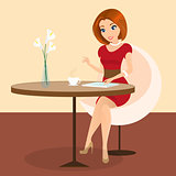 Young pretty woman sitting alone in the cafe and using a tablet pc