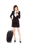 business woman watching smart phone with her  baggage