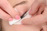 wiping mascara from eyelashes