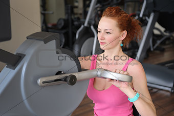 girl doing hands spinning machine workout