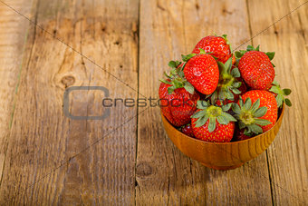 fresh strawberries in wood bowl 