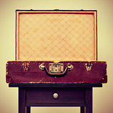old suitcase on a table, with a retro effect