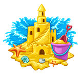 Sand castle with childs toys and blue waves on background