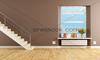 Brown living room with staircase