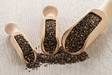 Chia seeds in wooden scoops