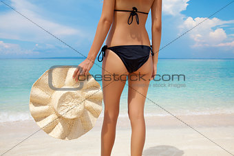 Woman standing on a perfect beach
