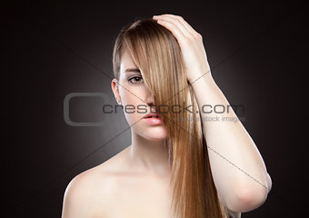 Young beauty with long straight hair