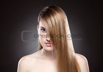 Young beauty with long straight hair