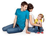 father, mother and young daughter in jeans