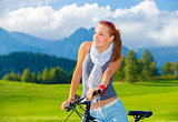 Cyclist girl in mountains