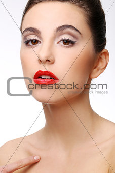 Beautiful girl with perfect skin and red lipstick