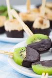 Fruits with chocolate on a stick