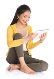 Asian girl using tablet computer