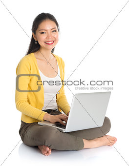 Asian girl using notebook computer