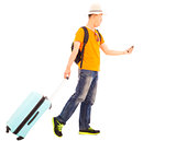 young backpacker carrying a baggage and holding a smartphone