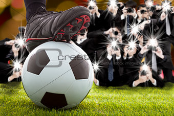 many photographer taking winner soccer player feet on field