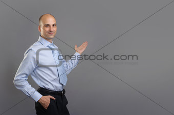 Happy Young Businessman Presenting