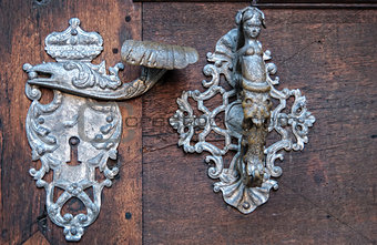 Door-handle decoration detail of old  entrance door in Prague