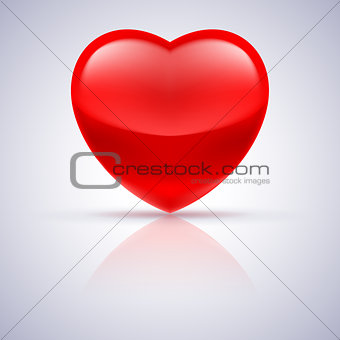 Glossy red heart on grey