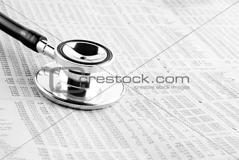 stethoscope on financial newspaper