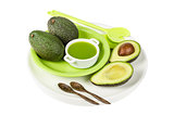 Fresh avocado with juice on the plate isolated