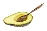 Fresh avocado with wooden spoon isolated