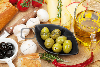 Olives, mushrooms, bread, vegetables and spices