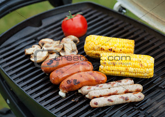 Grill bbq sausages and vegetables