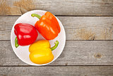 Colorful bell peppers on plate