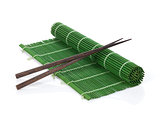 Chopsticks over bamboo mat