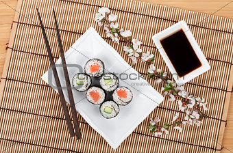 Sushi set with fresh sakura branch