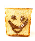 funny toast bread with chocolate smile on white background