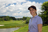 Attractive female golfer on the golf course