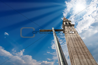Cross and Belfry on Blue Sky