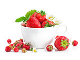 Fresh strawberry in cup with green leaf and flower