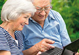 Senior couple with  laptop