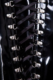 Close-up shot of black corset with d-rings 