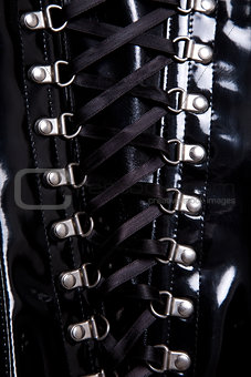 Close-up shot of black corset with d-rings 