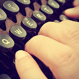 typing on an old typewriter, with a retro effect